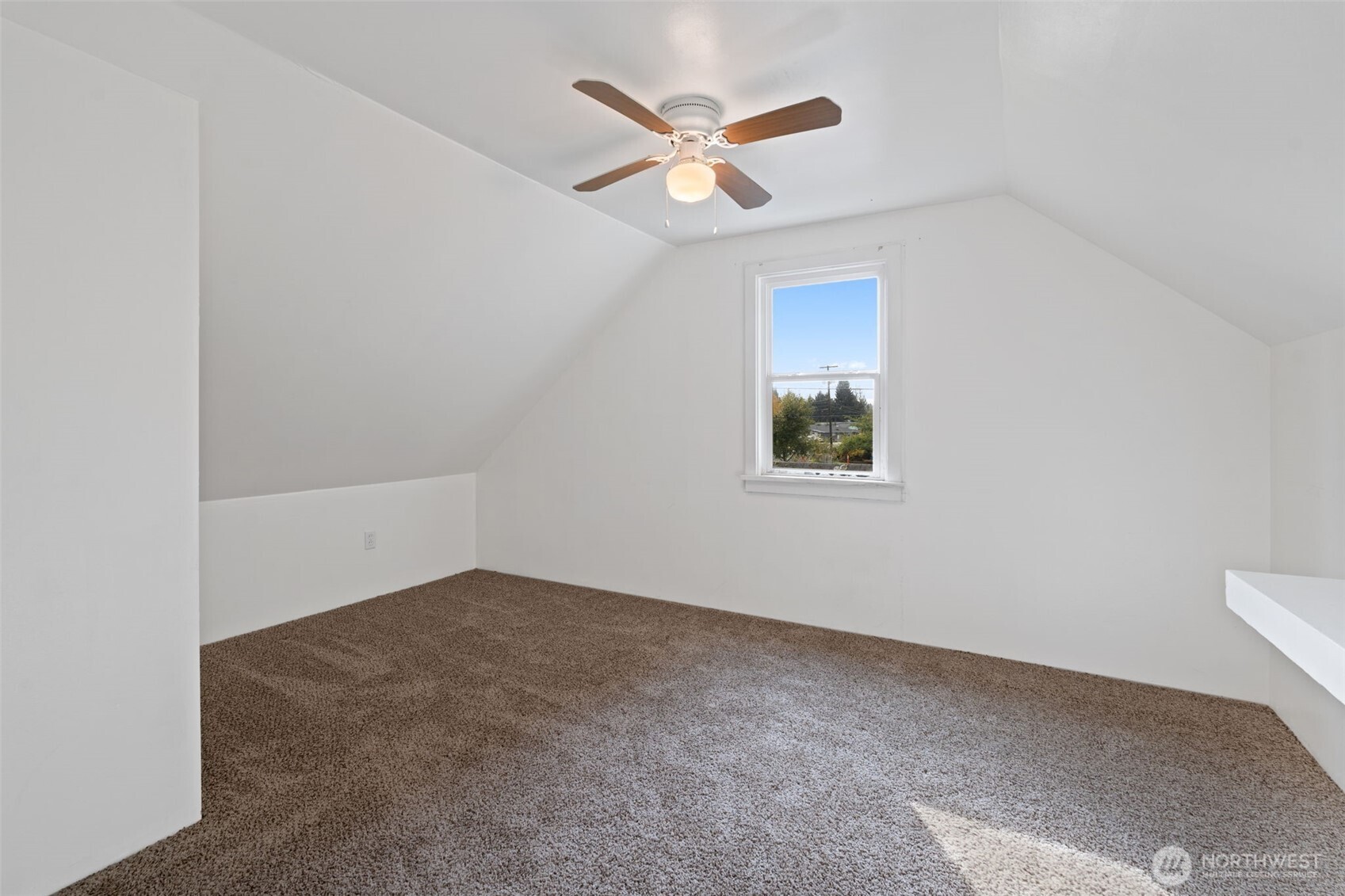 2403 34th Avenue Longview, WA 98632 - Photo 25 of 40 an empty room with closet and ceiling fan