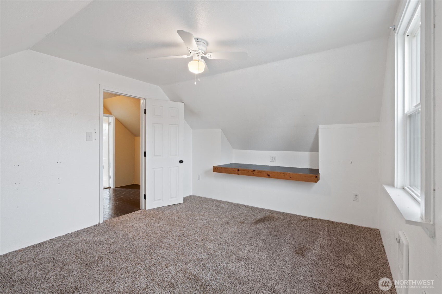 2403 34th Avenue Longview, WA 98632 - Photo 27 of 40 a view of an empty room with a chandelier fan