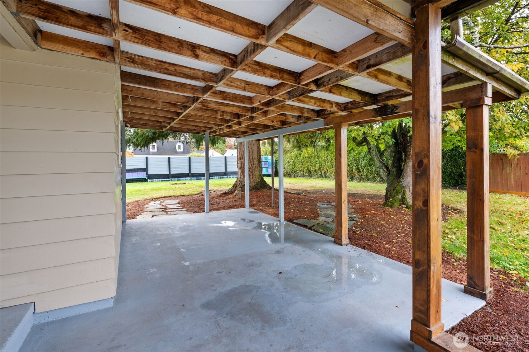 2403 34th Avenue Longview, WA 98632 - Photo 34 of 40 a view of a room with wooden walls and a large tree