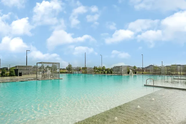 a view of a lake with houses in the back