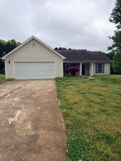a view of a yard in front of a house with a yard