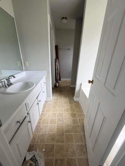506 Cherokee Road Winder, GA 30680 - Photo 11 of 11 a bathroom with a sink a toilet and a mirror