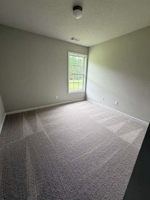 506 Cherokee Road Winder, GA 30680 - Photo 7 of 11 an empty room with windows