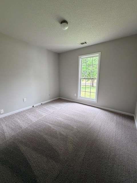 506 Cherokee Road Winder, GA 30680 - Photo 9 of 11 an empty room with a window