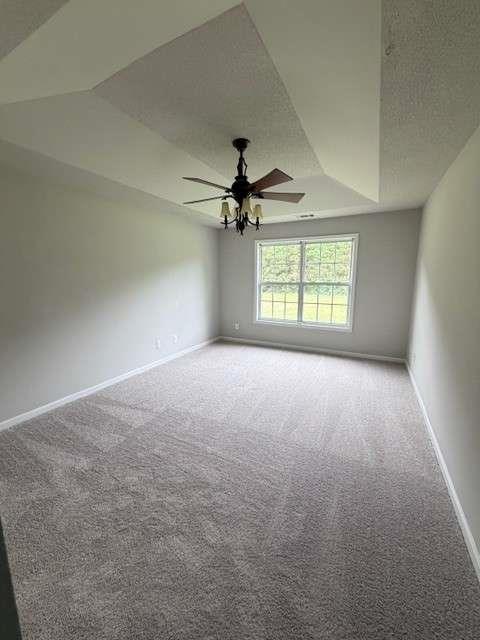 506 Cherokee Road Winder, GA 30680 - Photo 10 of 11 an empty room with windows and ceiling fan