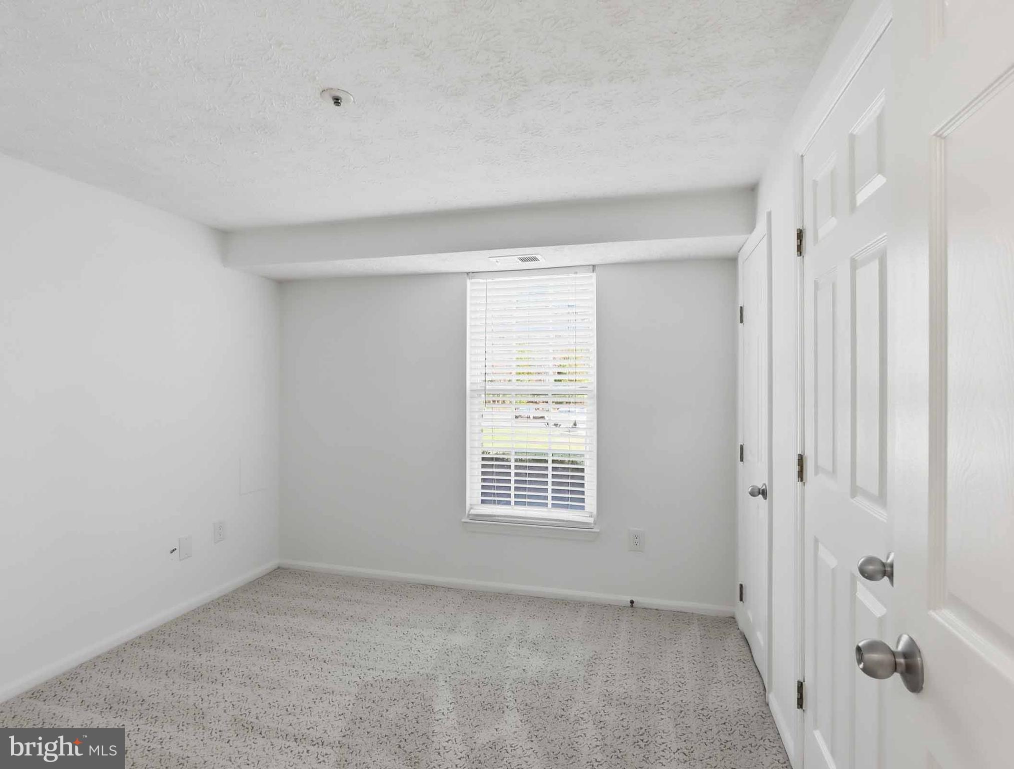 697 Deering Road, Unit 5A Pasadena, MD 21122 - Photo 16 of 24 a view of an empty room with a window