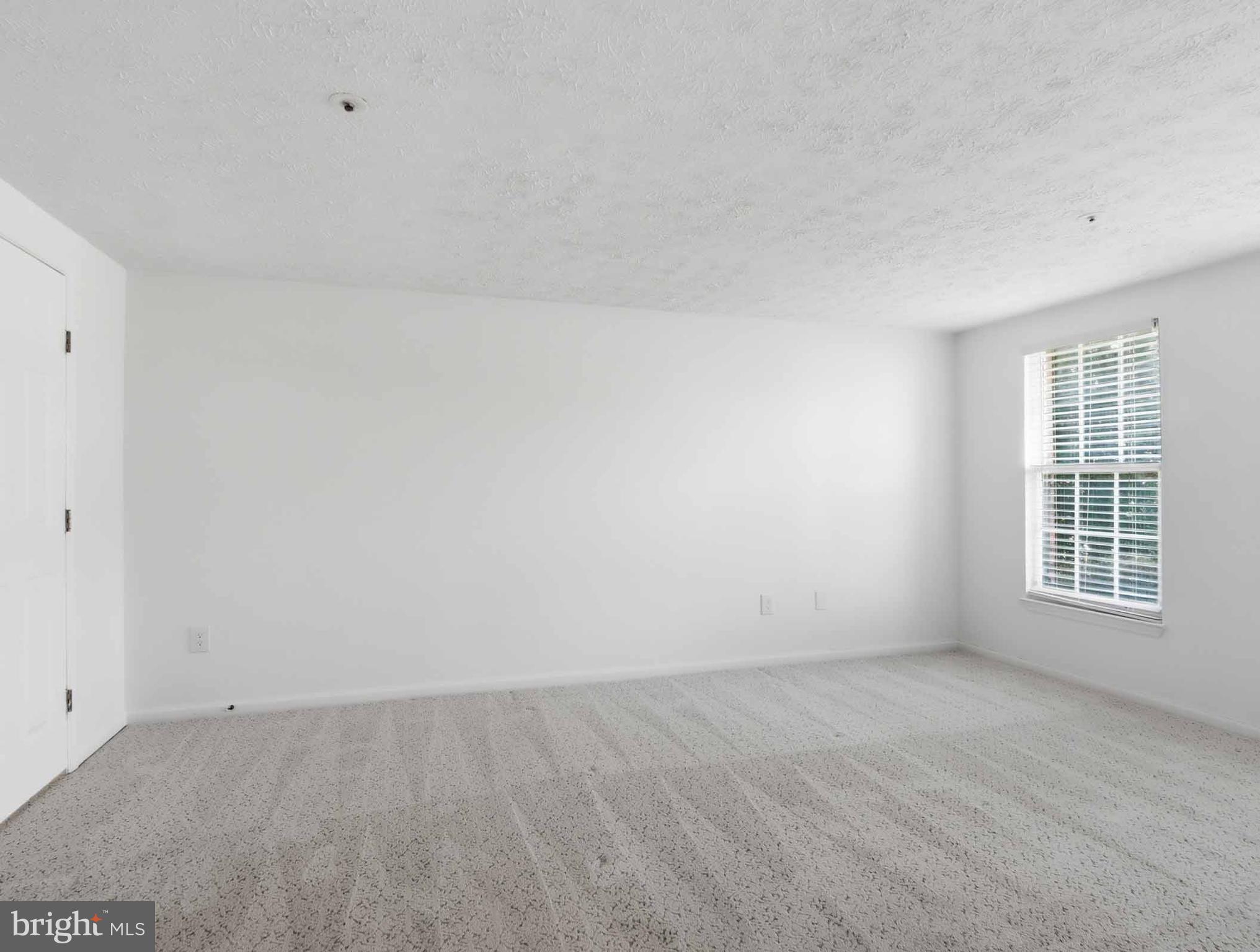 697 Deering Road, Unit 5A Pasadena, MD 21122 - Photo 19 of 24 an empty room with windows