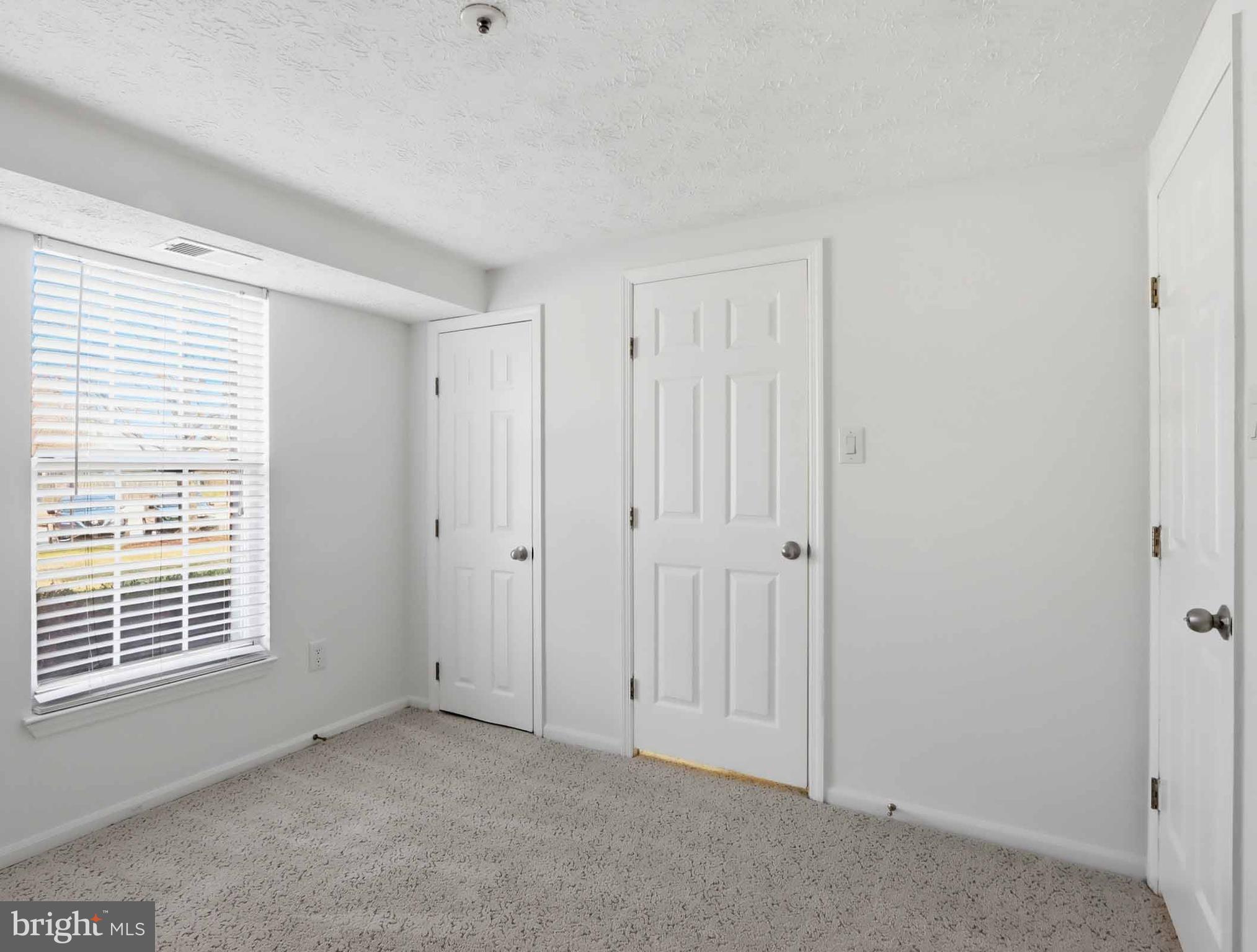 697 Deering Road, Unit 5A Pasadena, MD 21122 - Photo 23 of 24 a view of an empty room with a window