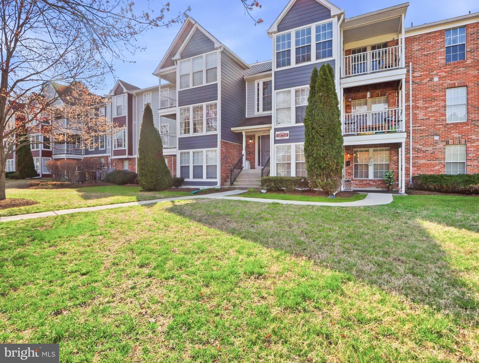 697 Deering Road, Unit 5A Pasadena, MD 21122 - Photo 3 of 24 a view of a building with a yard