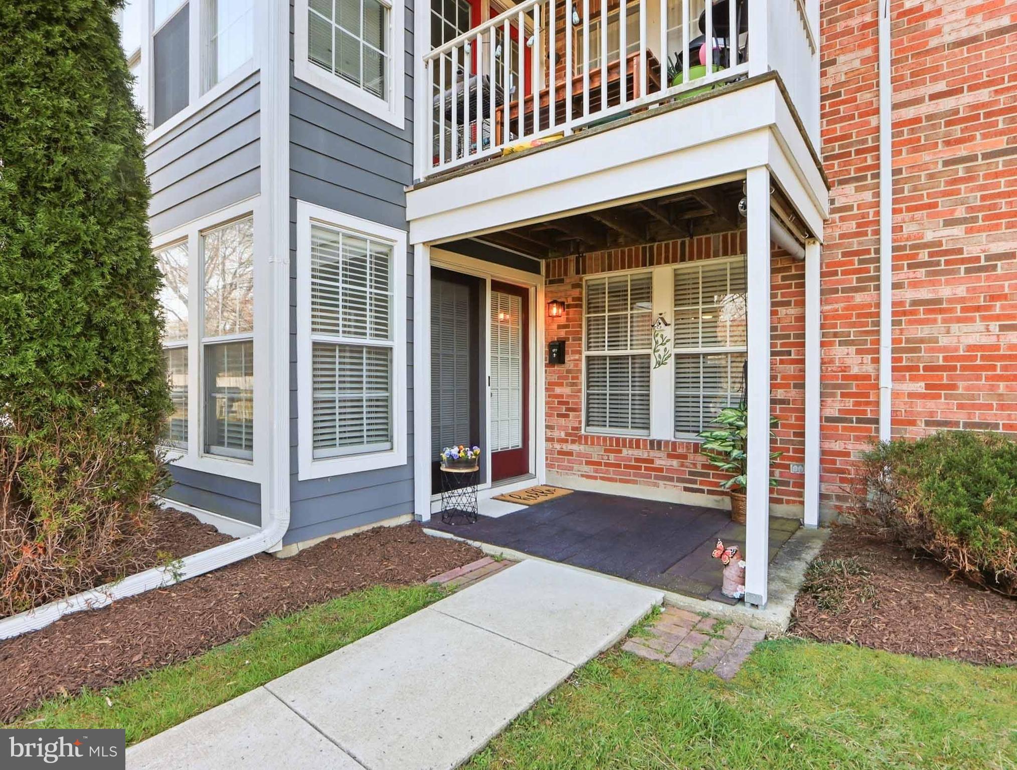 697 Deering Road, Unit 5A Pasadena, MD 21122 - Photo 6 of 24 a view of a house with a yard