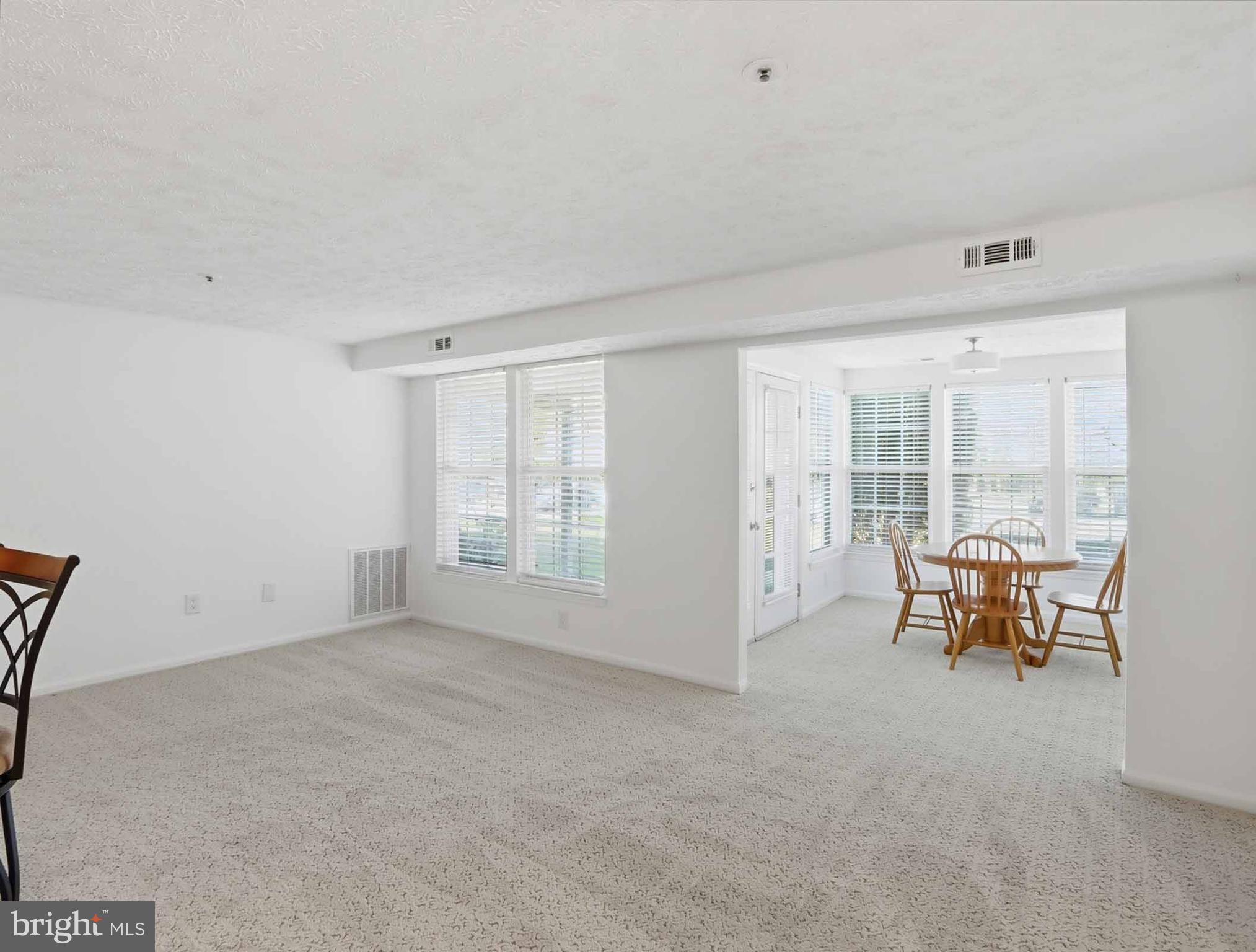 697 Deering Road, Unit 5A Pasadena, MD 21122 - Photo 7 of 24 a view of an empty room with furniture and a window