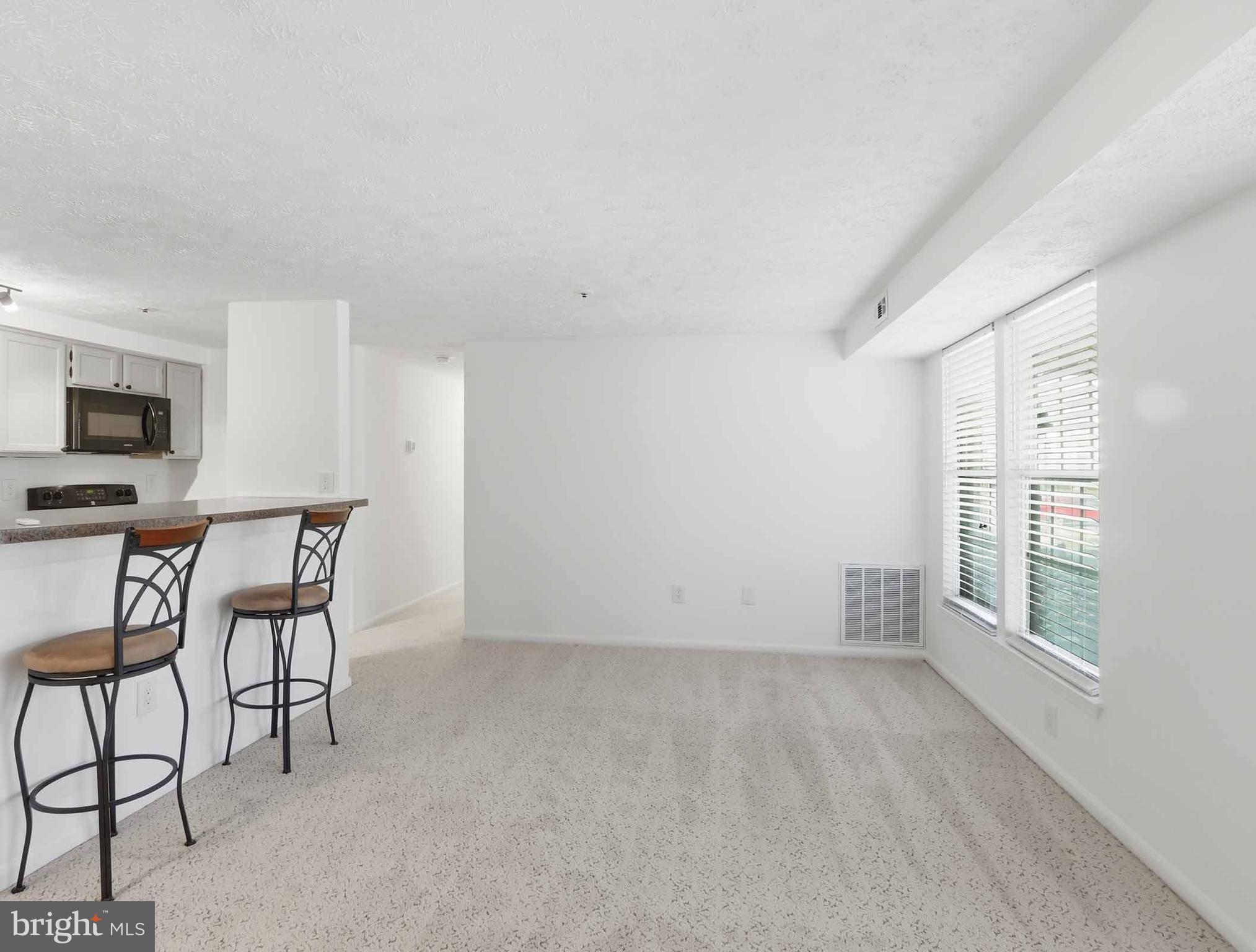 697 Deering Road, Unit 5A Pasadena, MD 21122 - Photo 8 of 24 a view of workspace with furniture and window
