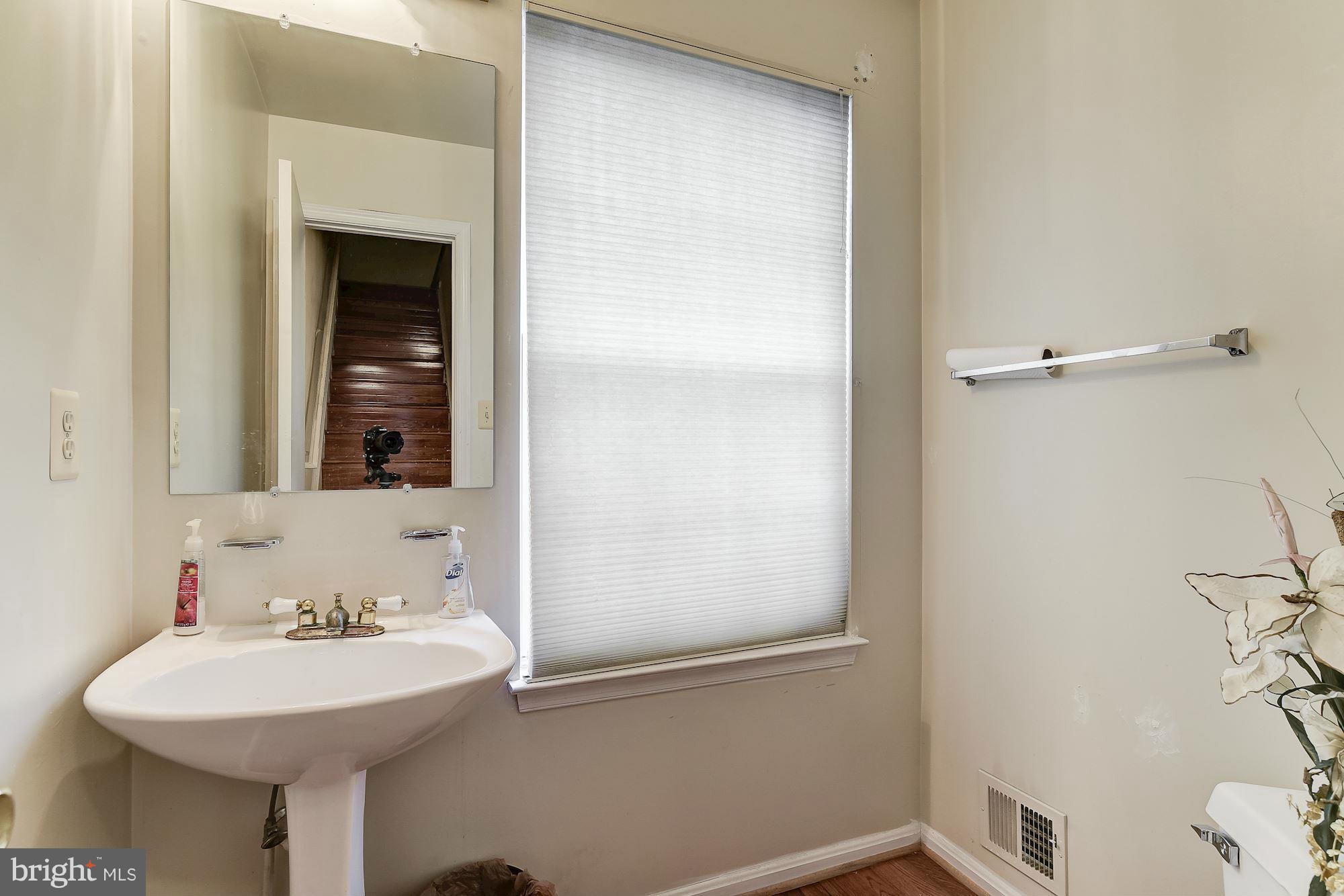 804 Alabaster Court Capitol Heights, MD 20743 - Photo 14 of 30 a bathroom with a sink and a mirror