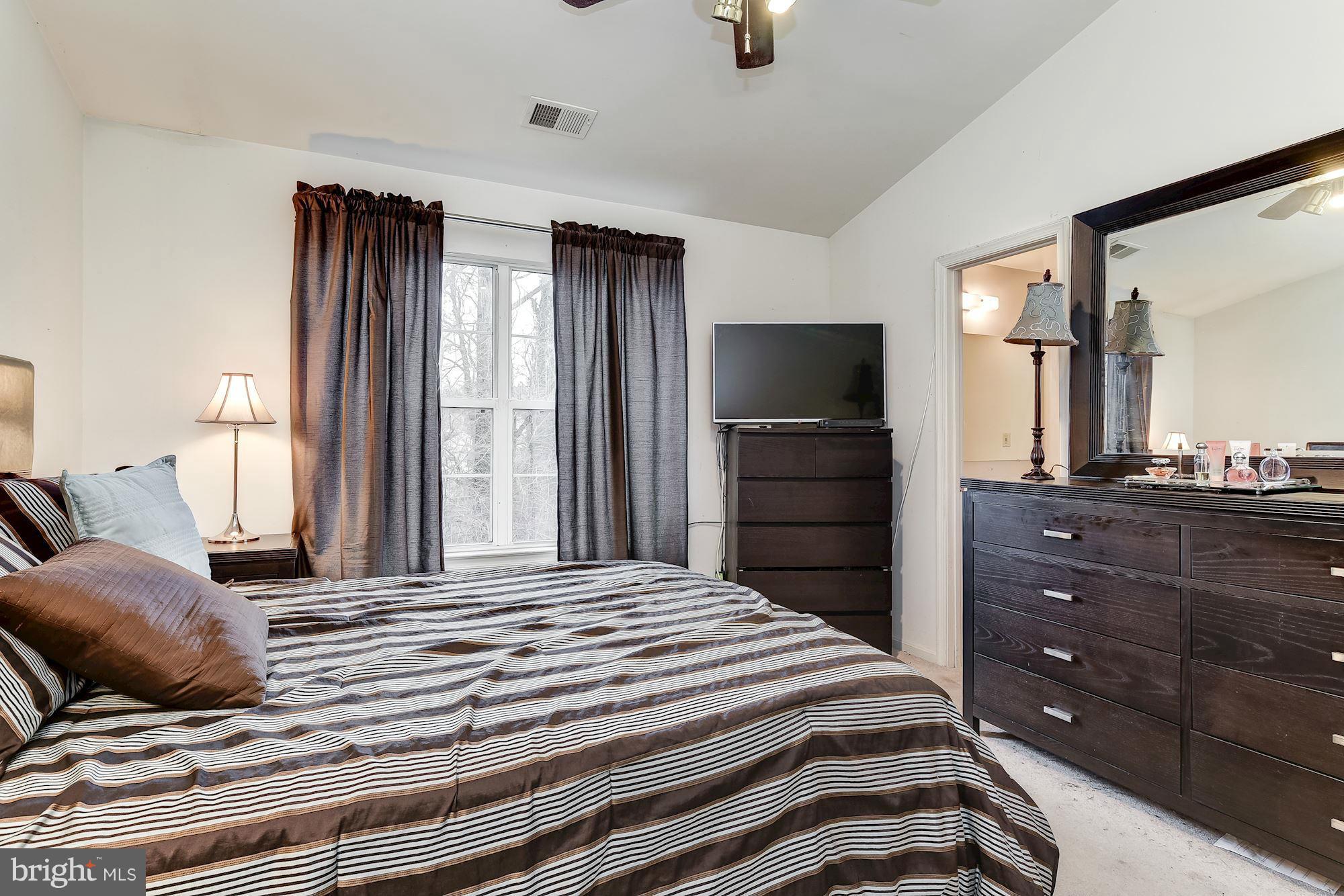 804 Alabaster Court Capitol Heights, MD 20743 - Photo 16 of 30 a bedroom with a bed and a television