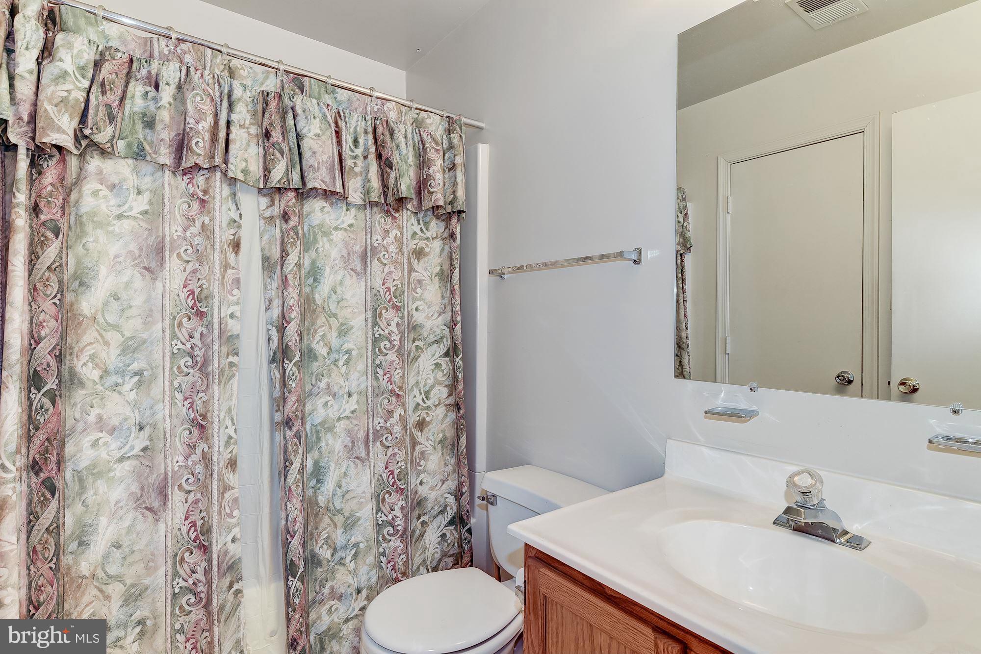 804 Alabaster Court Capitol Heights, MD 20743 - Photo 20 of 30 a bathroom with a sink and a mirror