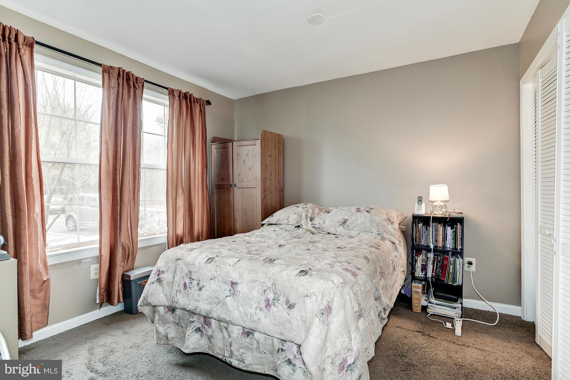 804 Alabaster Court Capitol Heights, MD 20743 - Photo 24 of 30 a bedroom with a bed and a window