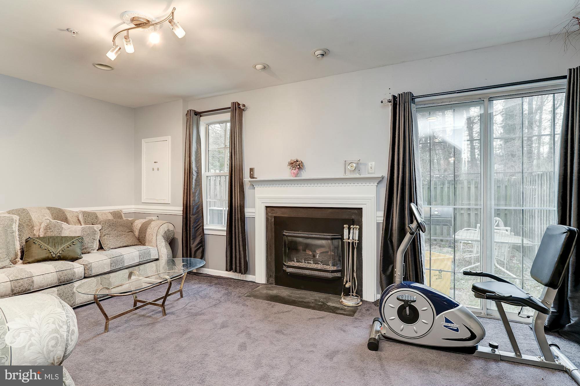804 Alabaster Court Capitol Heights, MD 20743 - Photo 26 of 30 a living room with furniture and a fireplace