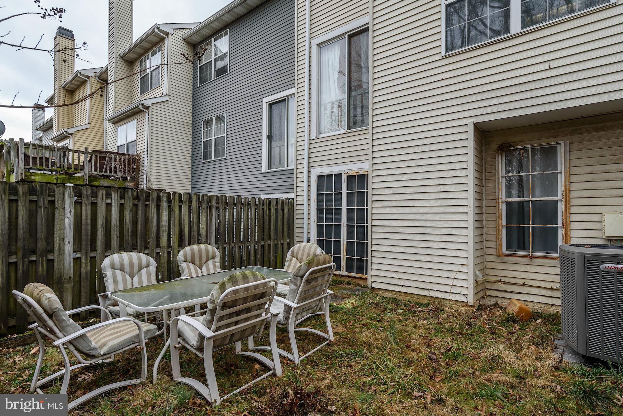 804 Alabaster Court Capitol Heights, MD 20743 - Photo 30 of 30 a backyard of a house with table and chairs