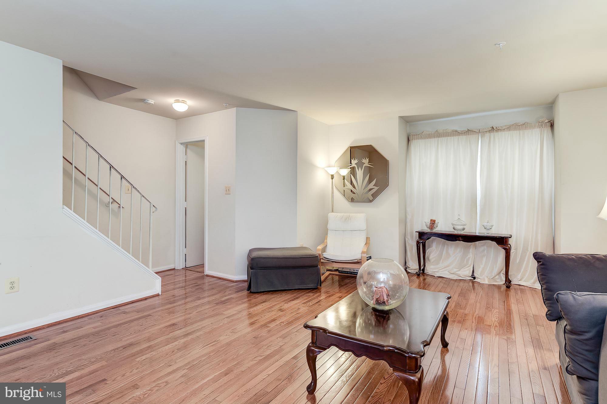 804 Alabaster Court Capitol Heights, MD 20743 - Photo 7 of 30 a view of a livingroom with furniture a table and chairs