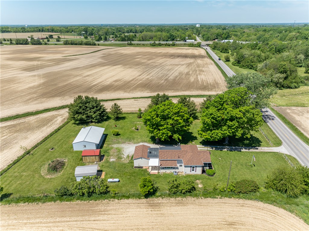 1217 Jasper Road Xenia, OH 45385 - Photo 11 of 62 This aerial view showcases a charming rural property with expansive fields and a peaceful setting.