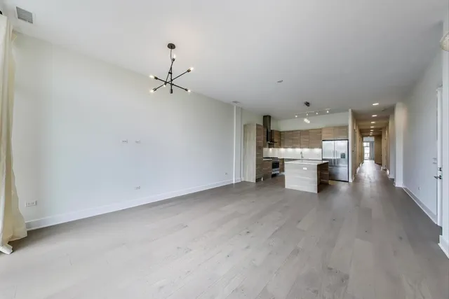 a kitchen with a sink stove and refrigerator