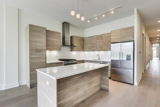 a kitchen with cabinets and appliances
