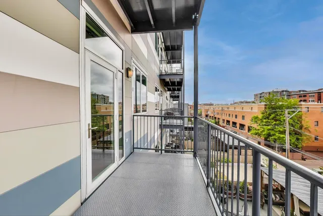 an empty room with a ceiling fan and carpet