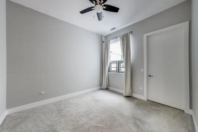 a bathroom with a bathtub shower sink mirror and toilet
