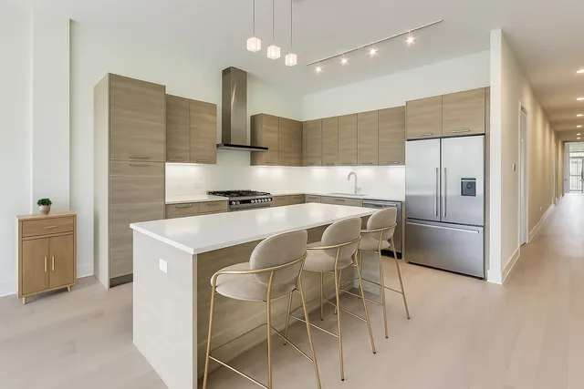 a balcony with table and chairs