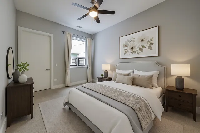 a living room with furniture and a potted plant