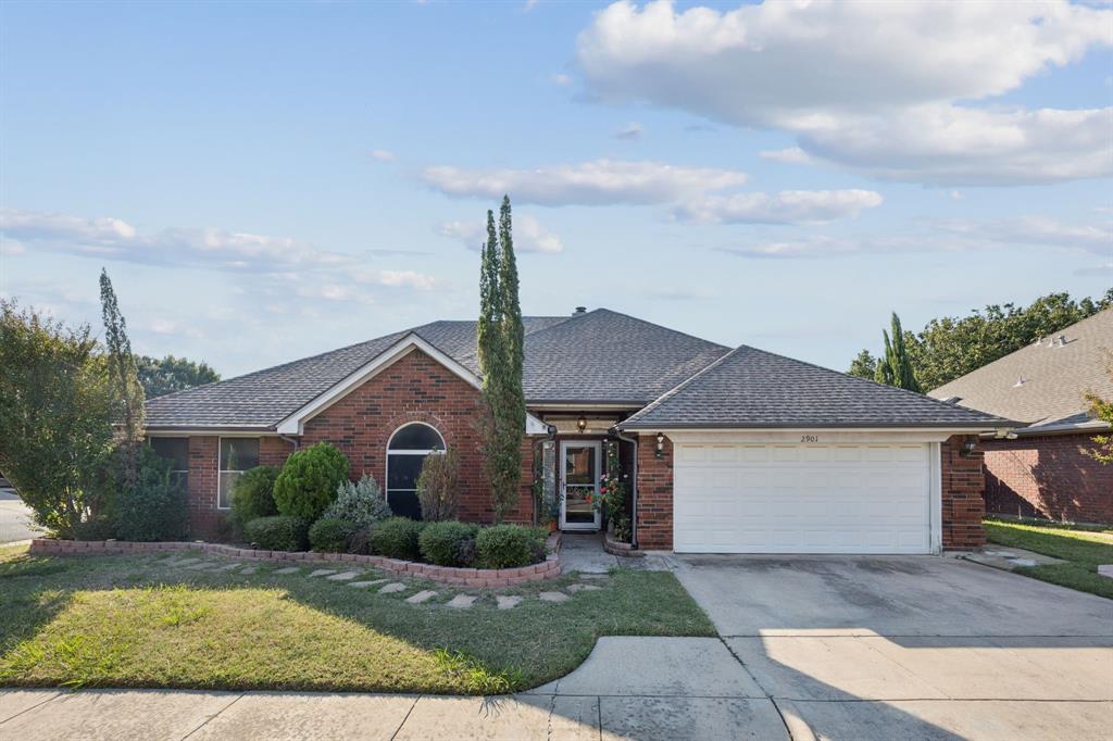 2901 Miles Way Bedford, TX 76021 - Photo 1 of 21 a front view of a house with garden