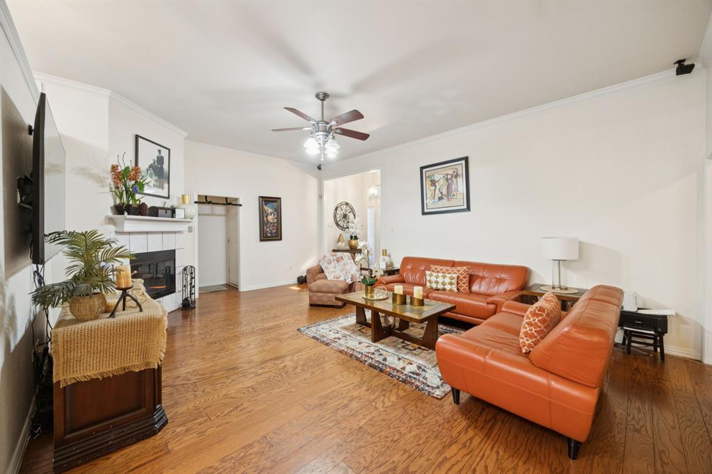 2901 Miles Way Bedford, TX 76021 - Photo 3 of 21 a living room with furniture a fireplace and a flat screen tv