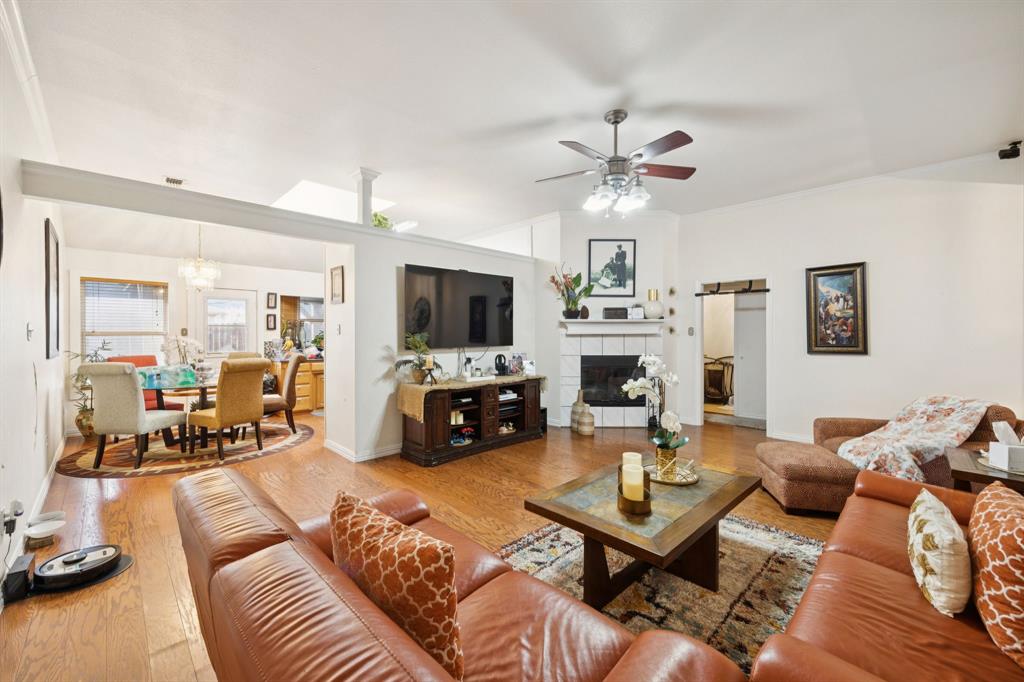 2901 Miles Way Bedford, TX 76021 - Photo 4 of 21 a living room with furniture a fireplace and a flat screen tv