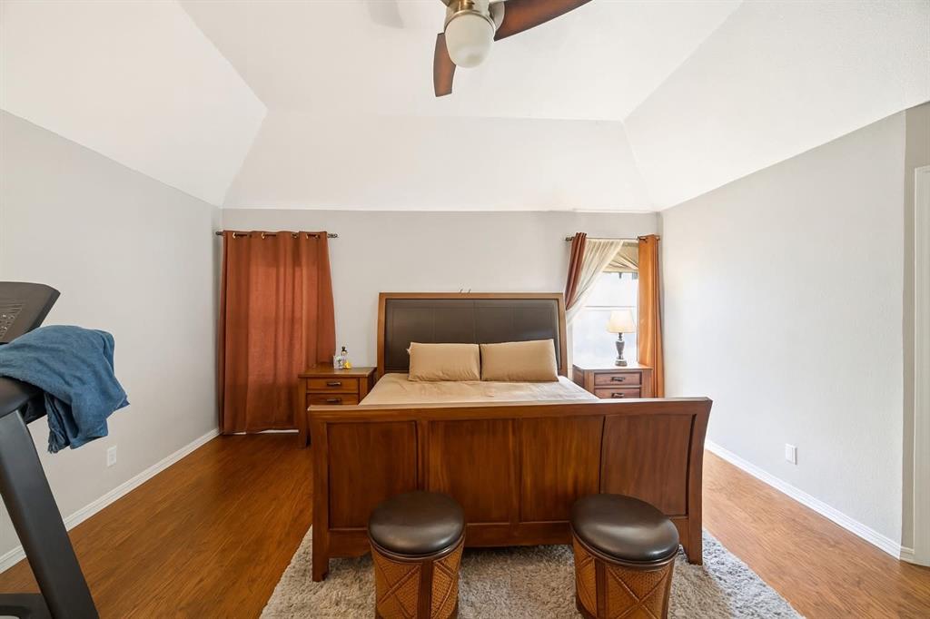 2901 Miles Way Bedford, TX 76021 - Photo 8 of 21 a bedroom with a bed and wooden floor