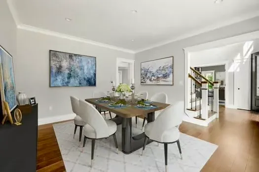 a view of a dining room with furniture and wooden floor