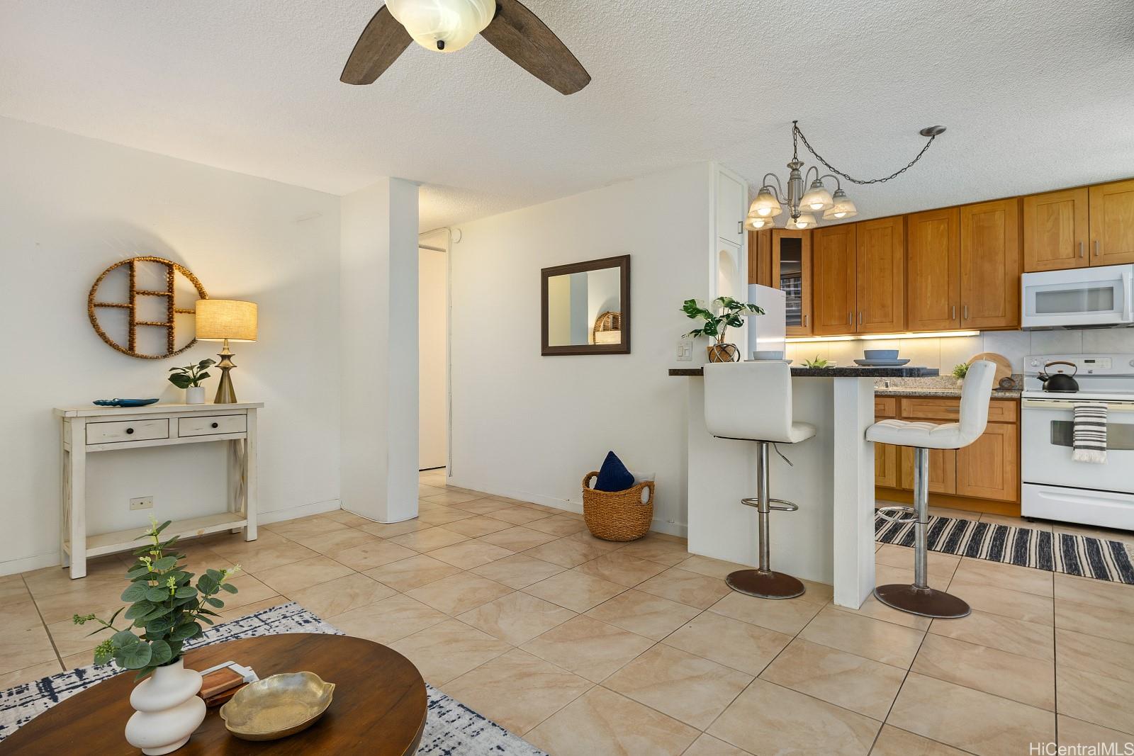 620 McCully Street, Unit 703 Honolulu, HI 96826 - Photo 7 of 25 The unit has been upgraded with all ceramic tiles.