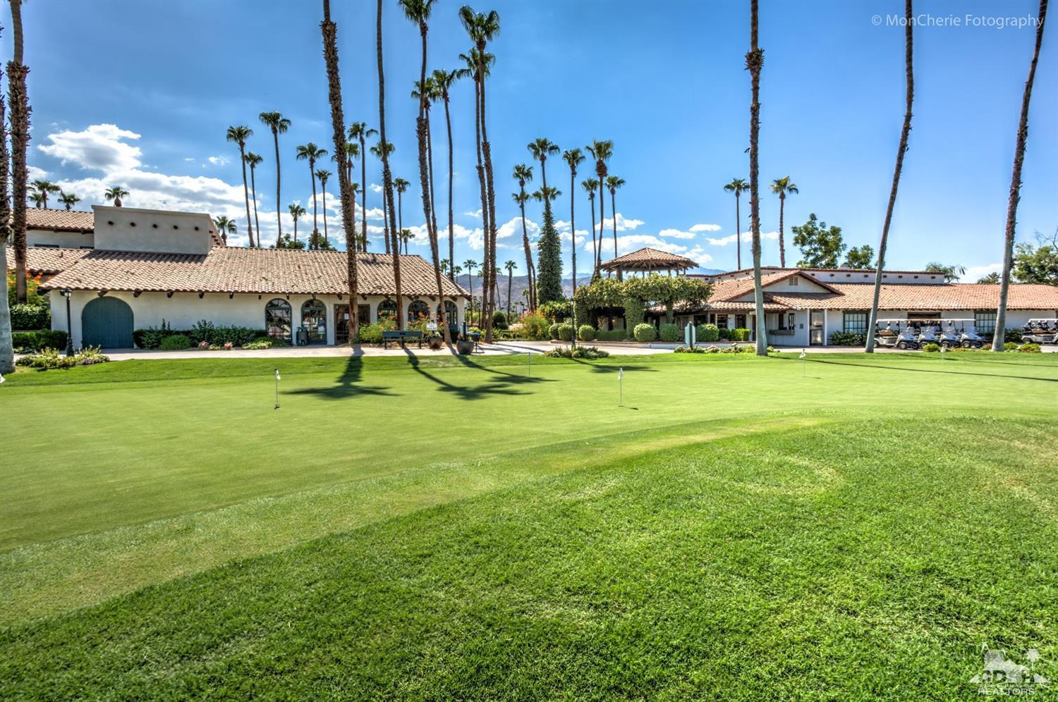 22 Leon Way Rancho Mirage, CA 92270 - Photo 30 of 35 a swimming pool with outdoor seating and yard