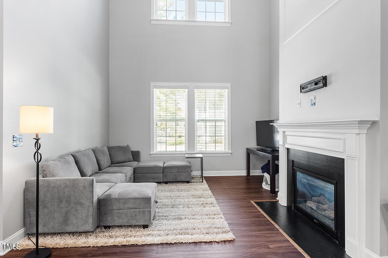 1337 Formal Garden Way Raleigh, NC 27603 - Photo 11 of 36 a living room with furniture and a fireplace