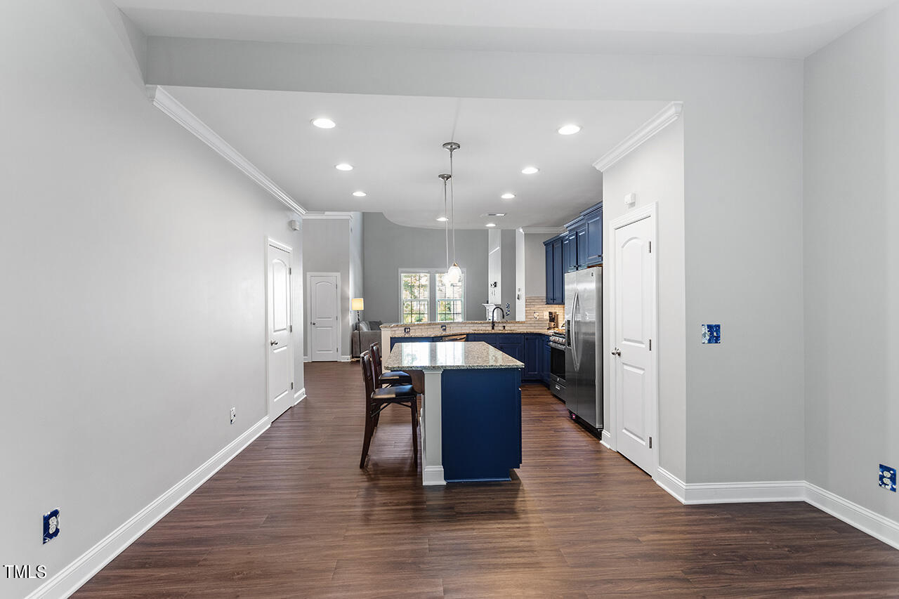 1337 Formal Garden Way Raleigh, NC 27603 - Photo 19 of 36 a view of a kitchen with dining table and chairs