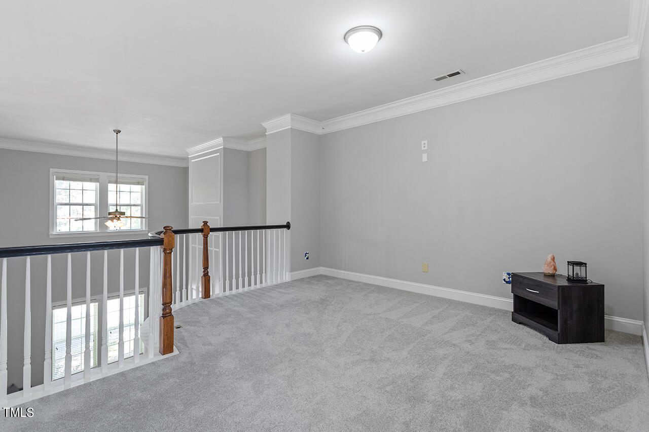 1337 Formal Garden Way Raleigh, NC 27603 - Photo 26 of 36 an empty room with windows