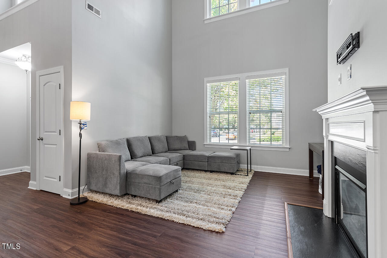 1337 Formal Garden Way Raleigh, NC 27603 - Photo 8 of 36 a living room with furniture and a fireplace