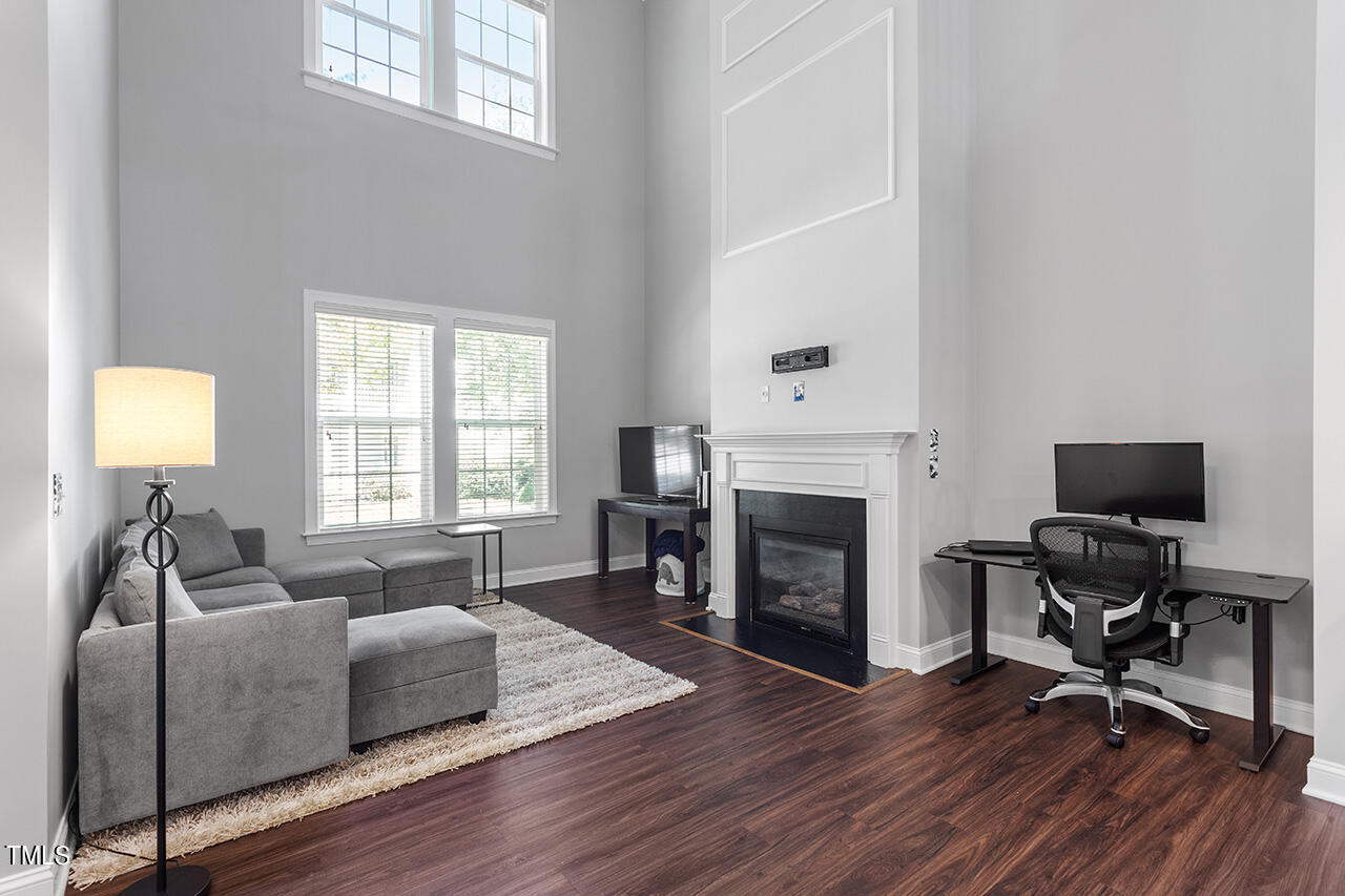 1337 Formal Garden Way Raleigh, NC 27603 - Photo 9 of 36 a living room with furniture fireplace and window
