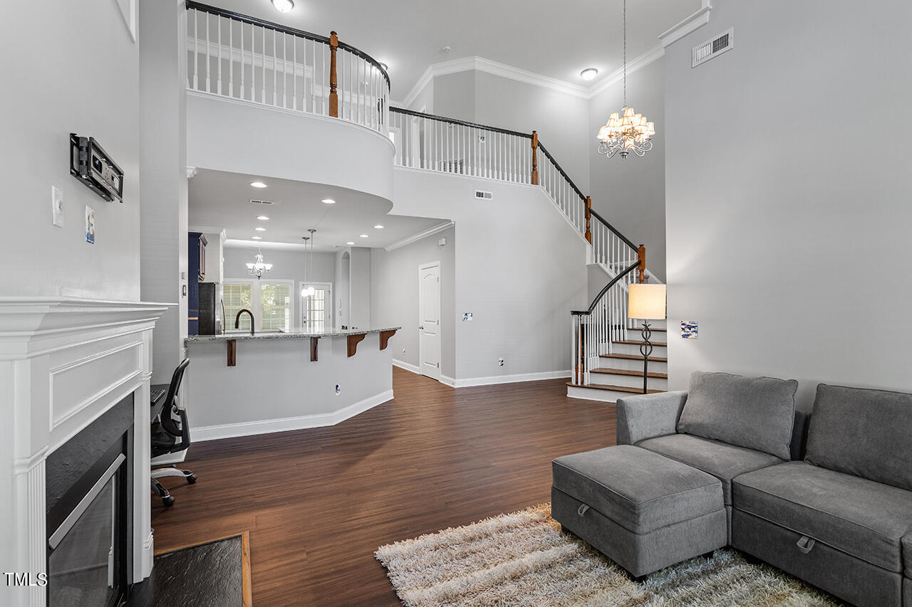1337 Formal Garden Way Raleigh, NC 27603 - Photo 10 of 36 a living room with furniture and a fireplace