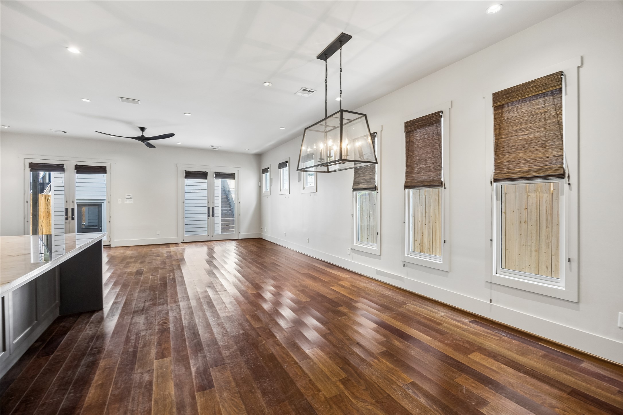 926 Nicholson Street Houston, TX 77008 - Photo 12 of 39 Framed by oversized windows and designer lighting, the dining space feels bright, welcoming, and connected to the heart of the home.
