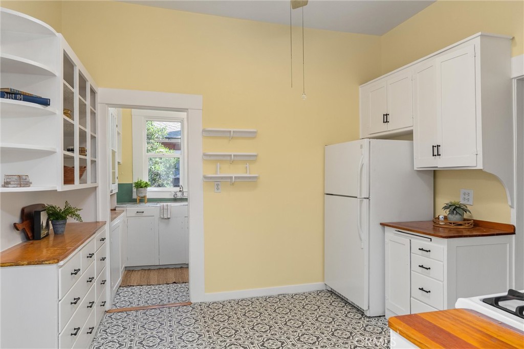 1805 Hemlock Street Chico, CA 95928 - Photo 23 of 61 a kitchen with a refrigerator and a stove
