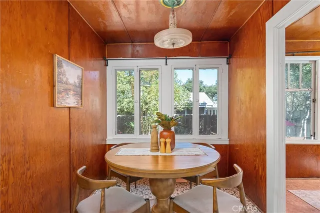 a bedroom with a bed and a potted plant