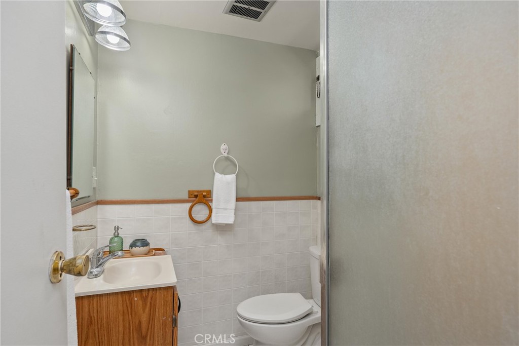 1805 Hemlock Street Chico, CA 95928 - Photo 33 of 61 a bathroom with a sink a toilet and a mirror