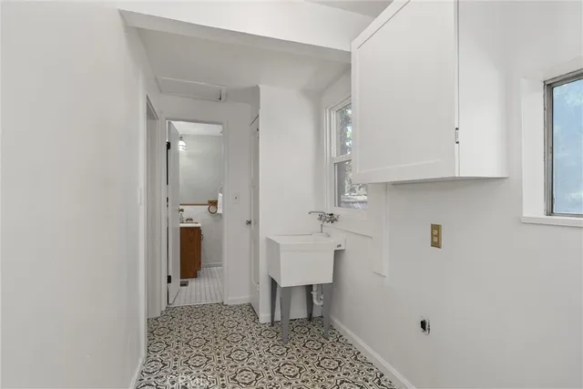 a view of a hall with wooden floor