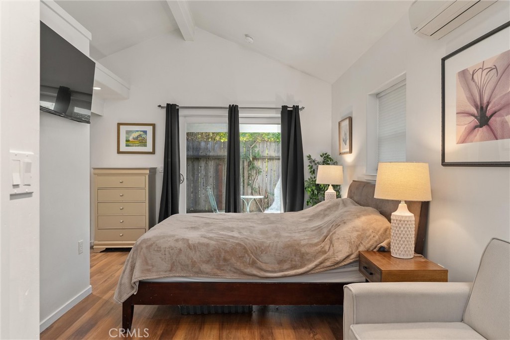 1805 Hemlock Street Chico, CA 95928 - Photo 49 of 61 a bedroom with a bed and wooden floor