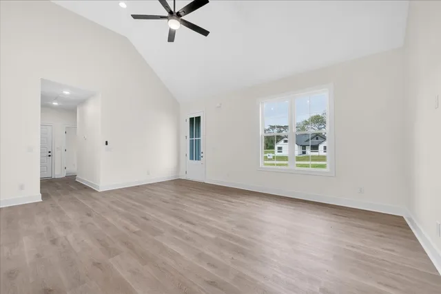 wooden floor in an empty room with a window